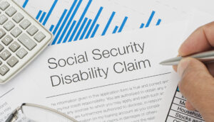 Close up of Social Security Disability Claim Form with writing h